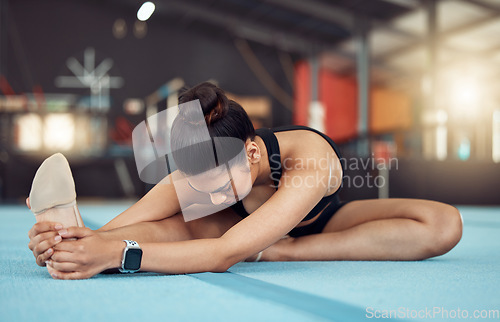 Image of Exercise, fitness and health, woman in a gym, stretching before workout. A girl, gymnast or dancer doing yoga or pilates to start training. Motivation, wellness and sports for healthy, fit lifestyle