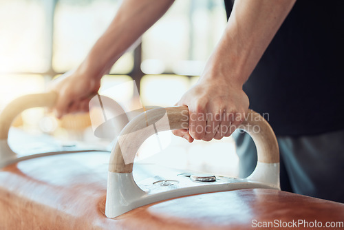 Image of Hands of man gymnast training on pommel horse for fitness, strong balance and flexibility workout sport goal. Sports athlete on exercise or practice gym equipment for better cardio performance