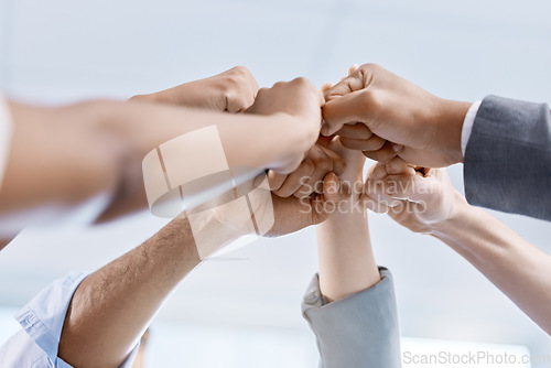 Image of Diversity, hand or fist of business people celebrate, unite and support each other. Collaboration of corporate professional team or company worker touching showing success inside a startup office