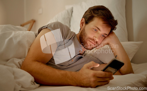 Image of Insomnia, bored and social media in bed to destress and calm. Sleeping problems, anxiety and depression or smartphone addiction. Mental health issues or cheating online with mobile app.
