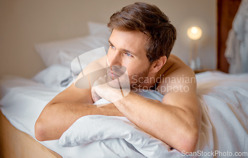 Image of Stress, depression or anxiety man in bed in house bedroom thinking or looking frustrated, lonely or sad. Suffering from mental health burnout or worried about future after divorce or job loss at home