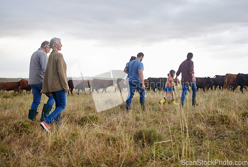 Image of Family together, cattle field and business with people you love. Countryside farmer parents walking in meadow with children to bond. Relationship with kids and sharing ranch for next generation.