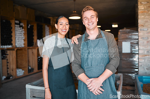 Image of Ceo, wine people or couple and store workers in their distillery cellar background. Portrait, man and woman winery employees with happy smile working at warehouse, factory or vineyard industry