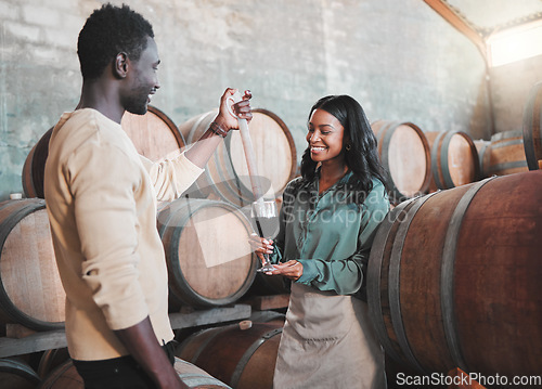 Image of Wine tasting, couple and distillery farm worker serving red alcohol drink in glass with pipette in countryside. Happy smile, learning man and woman or winery waiter on sustainability luxury vineyard