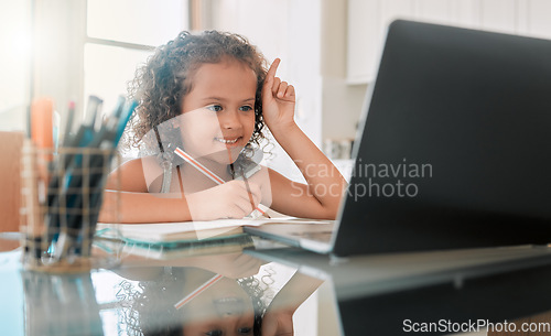 Image of School, learning and lesson for a little girl e-learning or online homeschooling using home internet and a laptop. An intelligent young child doing virtual self education on a website or app