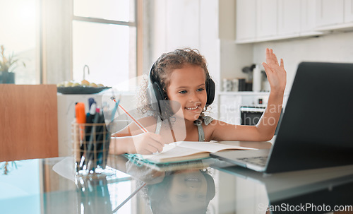 Image of Homeschool, education and video call distance learning for child on laptop in home living room. Smile, writing and happy girl or waving student greeting on online school and study class for homework