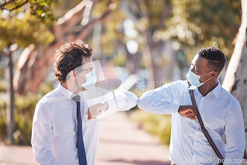 Image of Covid greet, social distancing and elbow bump by business men meeting and greeting outdoors. Happy, friendly and excited colleagues using covid19 prevention protocol and wearing masks