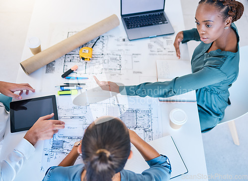 Image of Architects and business woman discuss building project plan, taking notes on laptop and digital tablet. Professional construction and engineering design firm planning real estate pricing negotiation.