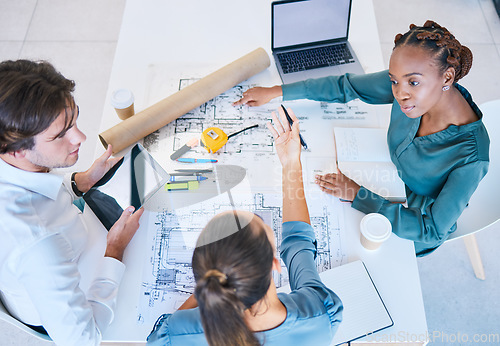 Image of Teamwork, planning and discussing architects working on new building, house or shopping mall design top view. A team, colleagues or workforce with blueprints, designs and plans for a company project