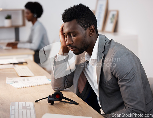 Image of Tired, sleeping and overworked while working late in a call center or telemarketing agency. Stress, burnout and fatigue while putting in long hours for customer service, CRM and contact us support