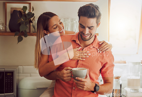 Image of Happy, in love and carefree couple embracing, bonding and being affectionate at home together. Young boyfriend and girlfriend hugging, relaxing, talking, being playing and enjoying their relationship