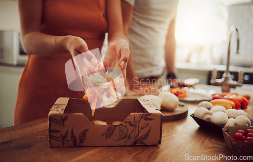 Image of Recycle, sustainability and eco friendly cooking with a couple preparing food in the kitchen at home. Health, wellness and eating with a vegan man and woman recycling fresh, vegetarian produce