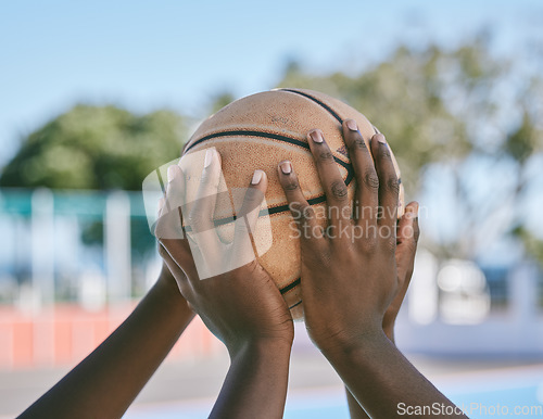 Image of Teamwork, support and hands holding basketball start sports competition, game and league match. Black community of athlete playing, training and competing on outdoor court for good sportsmanship