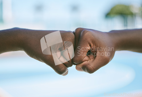 Image of Success, support and hands giving fist bump for motivation, celebration and standing in unity outside in nature. Closeup of people showing passion, growth and connection against a blurred background