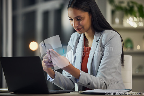 Image of Stock market, phone app and finance planning for financial advisor, trader and investor working late at night. Smiling overtime worker reading, monitoring investment or cryptocurrency profit on tech