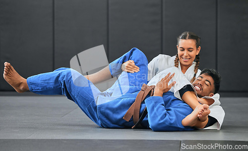 Image of Karate, judo and aikido fighters fighting to win in martial arts fight competition to train or practice skills. Winning competitive female or athlete in match with submission self defense technique