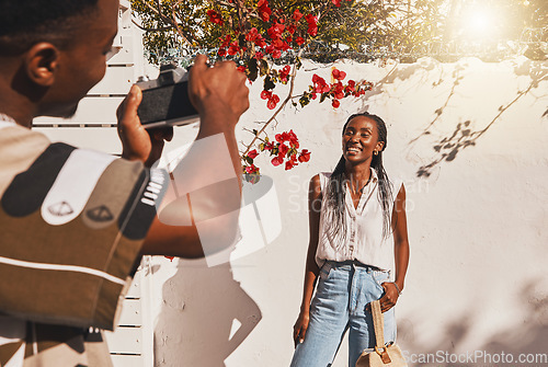 Image of Photographer, portrait and happy model woman in summer clothes for a creative fashion shoot outdoors. Influencer, freelancer and entrepreneur in professional photography taking social media content