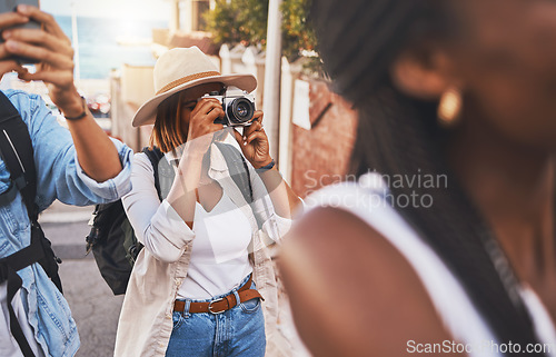 Image of Travel, tourism and photograph with a woman tourist taking a picture while on holiday, vacation or weekend getaway. Memories, sightseeing and overseas with a young female using a camera abroad