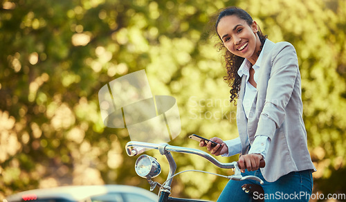 Image of Business woman, travel with bike and phone in sustainable environment or park with trees. Sustainability corporate worker portrait, bicycle and digital carbon footprint for green, healthy lifestyle