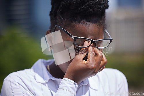 Image of Headache, stress or mental health and a frustrated or sad black woman with depression outside. Anxiety, pain or anger and a female struggling with burnout, compliance or making a mistake outdoors