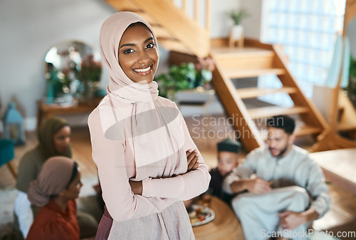 Image of Muslim islam woman on EID with family at house in .Pakistan, Saudi Arabia or Iran to celebrate ramadan. Young girl smile in hijab with food in solidarity on islamic holiday together in family home