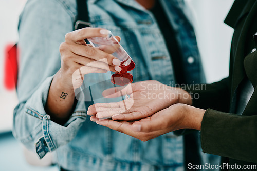 Image of Closeup of woman cleaning themselves with hand sanitizer, medical and healthy during the pandemic. Health, hygiene and safety adults clean their hands to stop the spread of covid in office space.