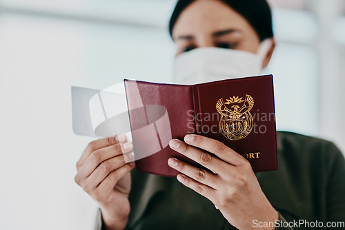 Image of Travel, covid passport and restrictions while holding flight ticket and pass with face mask at airport. Closeup of female hands holding identification for immigration during coronavirus pandemic