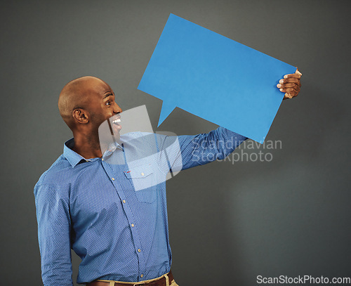 Image of Review, communication and speech bubble with business man marketing, holding and advertising his message on a blank board. Poster, billboard and mock up with empty message board with copy space.