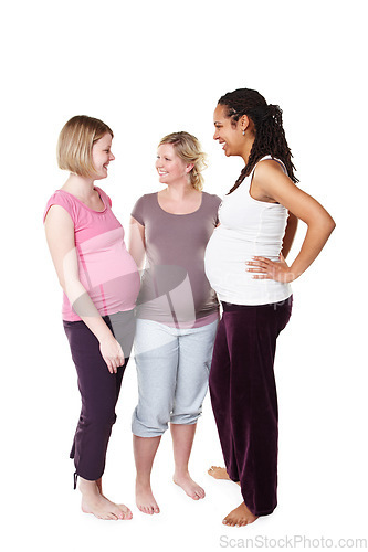 Image of Happy pregnant friends talking in white background studio with pilates, health or yoga clothes. Mother, maternity and communication with women having a pregnancy lifestyle discussion together