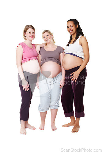 Image of Pregnant, happy and diversity women pregnancy portrait, mother to be with wellness success smile with white background in studio. Support, maternity and friends with pilates, health or yoga clothes