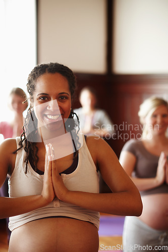 Image of Wellness, yoga and meditation of pregnant friends or women with spiritual, health and healthy lifestyle with prayer hands sign. Portrait of happy mother to be in yoga class with smile in a zen studio