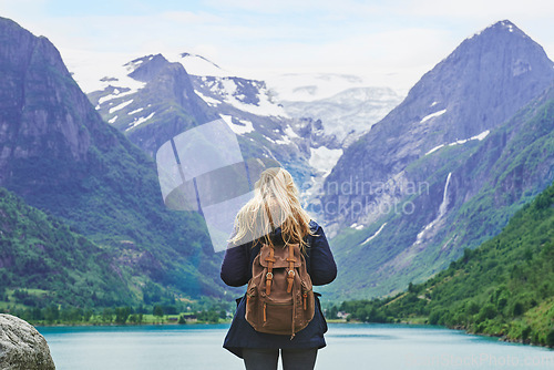 Image of Adventure backpacking woman enjoying view of majestic mountain lake explore travel discover beautiful earth