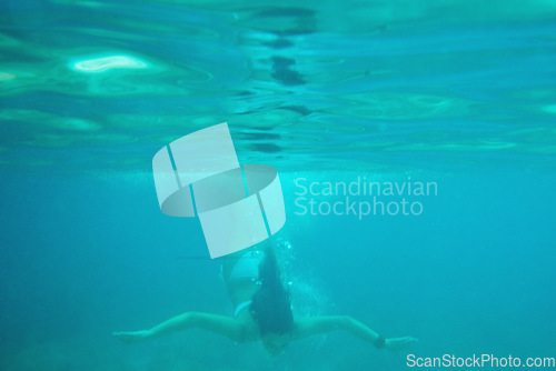 Image of Beautiful woman swimming underwater on paradise beach freedom wellbeing lifestyle summer vacation wanderlust