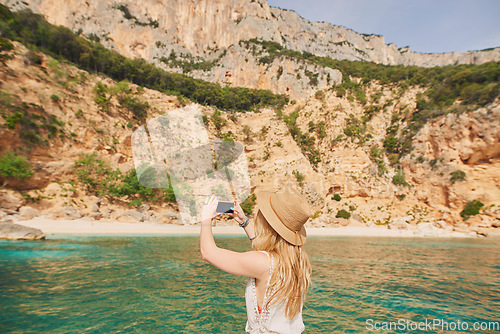 Image of Beautiful woman on speed boat driving to paradise beach island taking photo smart phone discover summer adventure vacation