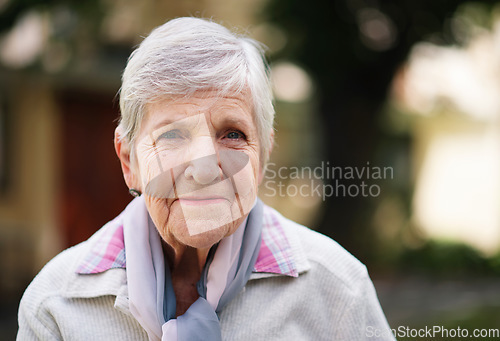 Image of Portrait of elderly woman smiling happy enjoying day in park
