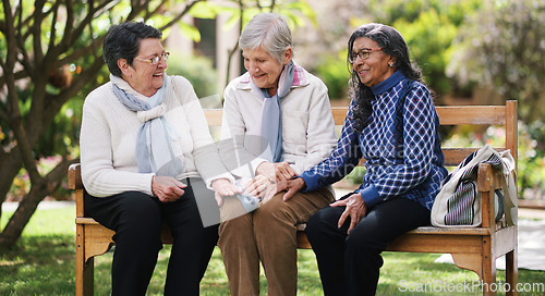 Image of Happy old women sitting on bench in park smiling happy life long friends enjoying retirement together