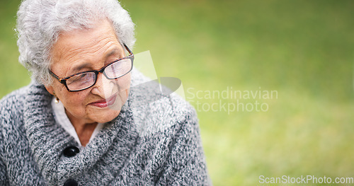 Image of Portrait elderly woman sitting on bench in park smiling looking thoughtful enjoying retirement contemplating life