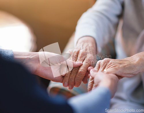 Image of Nurse helping old woman holding hands in retirement home