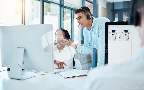 Image of Manager, boss or worker helping new employee as call center agent, training a consultant at work and planning workflow with colleague at company. Customer service team in conversation with coworker