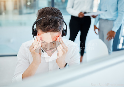 Image of Headache, stress and in pain call center telemarketing support or customer service consultant at company. Burnout overworked and tired man or contact us help desk consulting agent sick with migraine