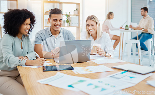 Image of Happy business people working on a laptop in a corporate office, reading goals and strategy. Diverse coworkers collaborating on a digital online project, discussing and positive problem solving