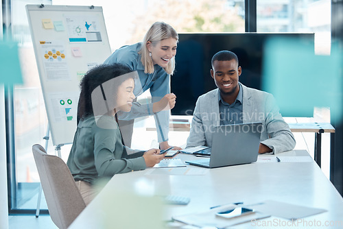 Image of Accounting business team happy about company financial growth and strategy in a meeting in an office. Excited colleagues working on a laptop in celebration of finance department success
