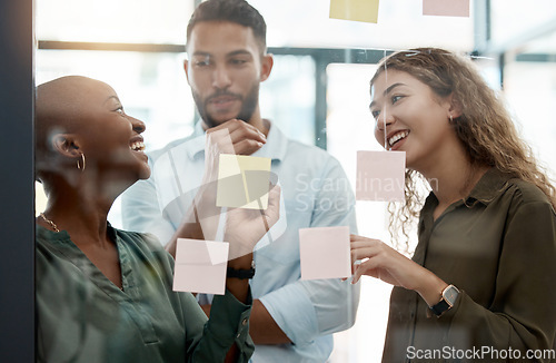 Image of Happy team collaboration and planning with sticky notes in an office of an advertising and marketing startup. Diversity, teamwork and business strategy in a creative staff business meeting at work