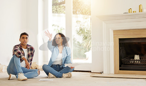 Image of New house, couple and moving in while planning and talking about renovation plans and vision idea for their dream home. Young man and woman holding paper for interior design for their property