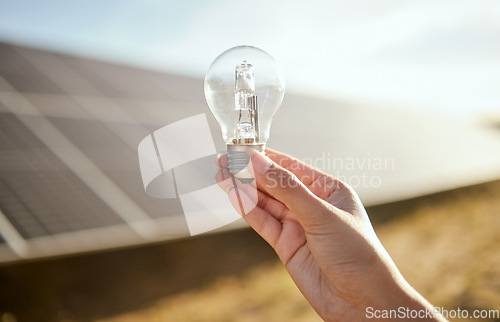 Image of Light bulb, solar panel and farmer hand with energy saving, electricity on sustainable agriculture farming for eco friendly idea. Sustainability, clean energy and carbon capture for green development
