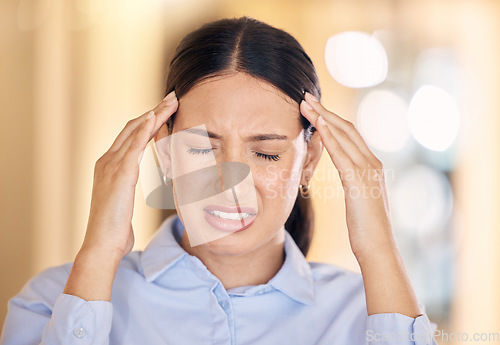 Image of Stress, burnout and headache business woman working with mental health, depression and anxiety in office. Corporate female employee or worker with a migraine and is depressed and frustrated.