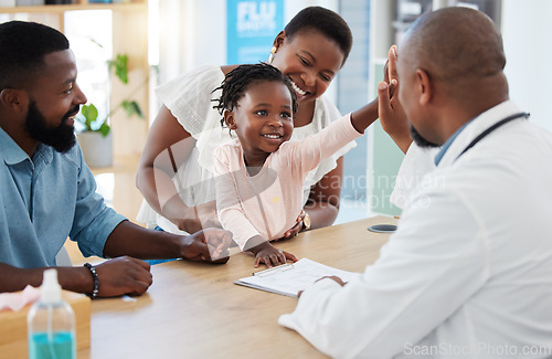 Image of High five, doctor and family with a girl and her parents at the hospital for consulting, appointment and healthcare. Medicine, trust and support in a medical clinic with a health professional