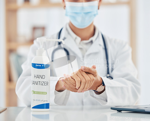 Image of Doctor hands sanitizer for covid cleaning, hygiene and protocol in hospital clinic for corona virus pandemic, disinfection and bacteria. Healthcare safety, flu germs and wellness to prevent sick risk