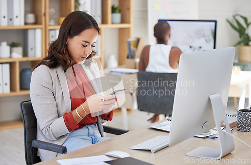 Image of Office woman, desk and reading phone message and communication while working in corporate building. Young business executive and professional workplace girl looking at text on smartphone.