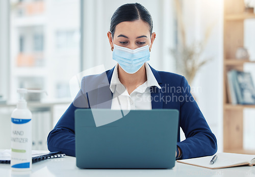 Image of Face mask, covid and business woman with laptop in safety, security and strategy to stop global virus in office. Employee and compliance worker against bacteria spread at company desk with technology